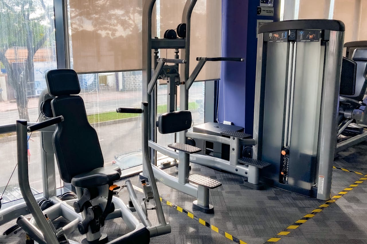 gallery-6 High-quality gym equipment set in a bright, indoor fitness center.
